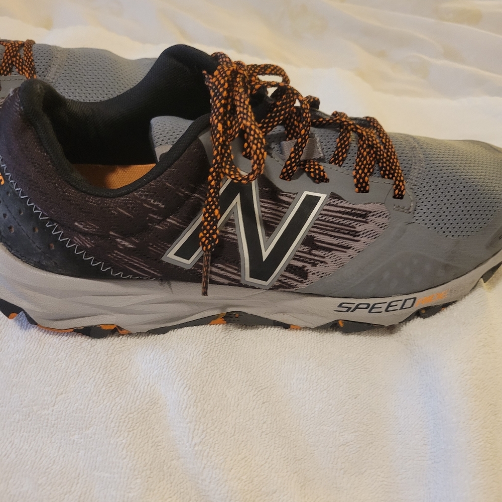 New Balance Gray and Black Sneakers with Orange Accents